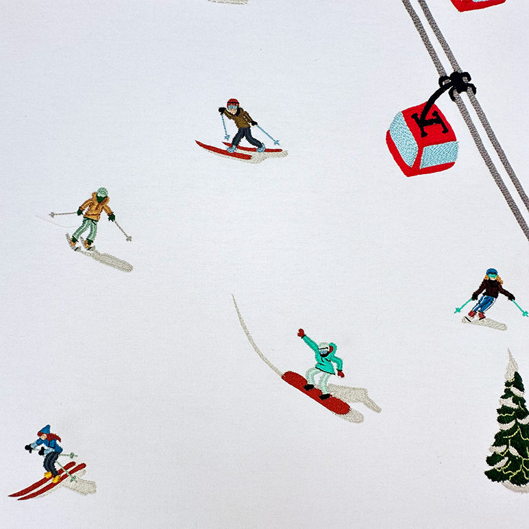 Illustration of skiers and a snowboarder with a ski lift and tree on a white background