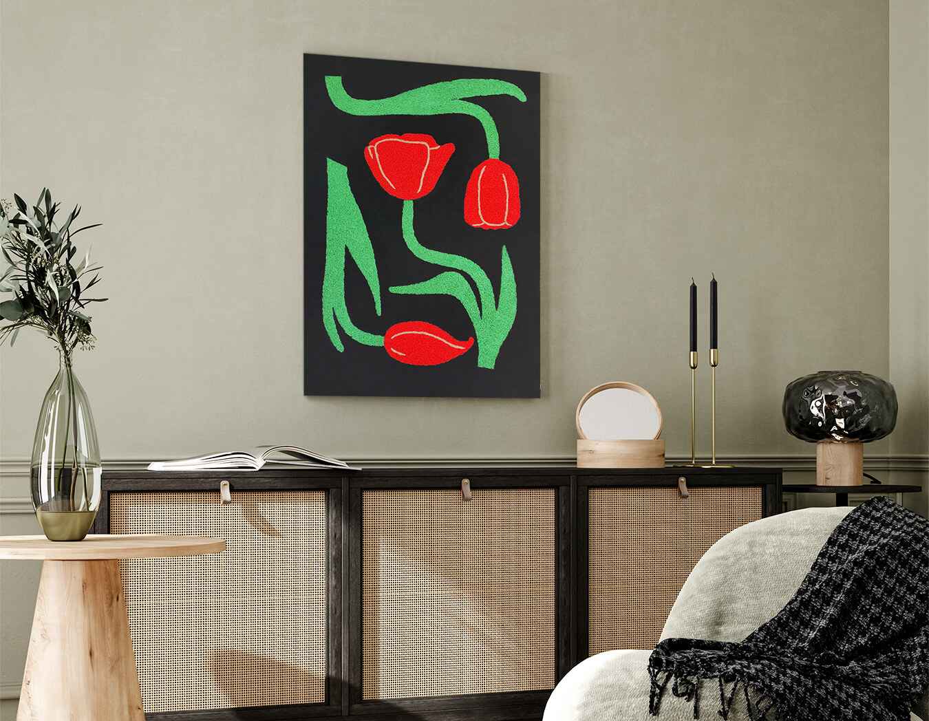 Modern interior with a painting of red tulips and green leaves on a wall.