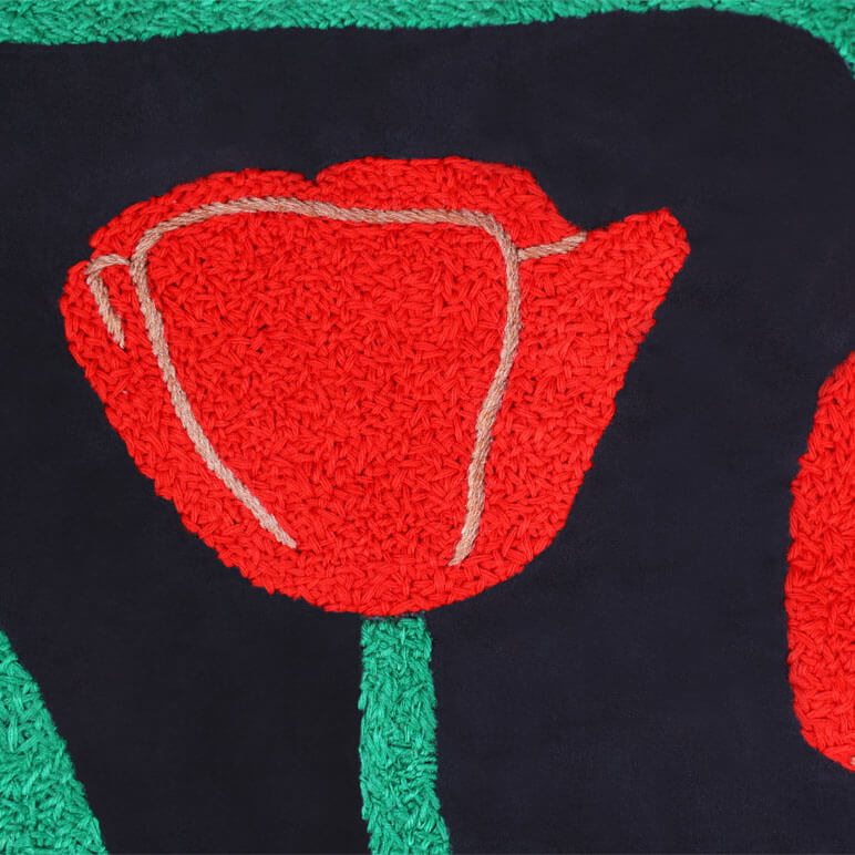 Red flower design on a black background with green border