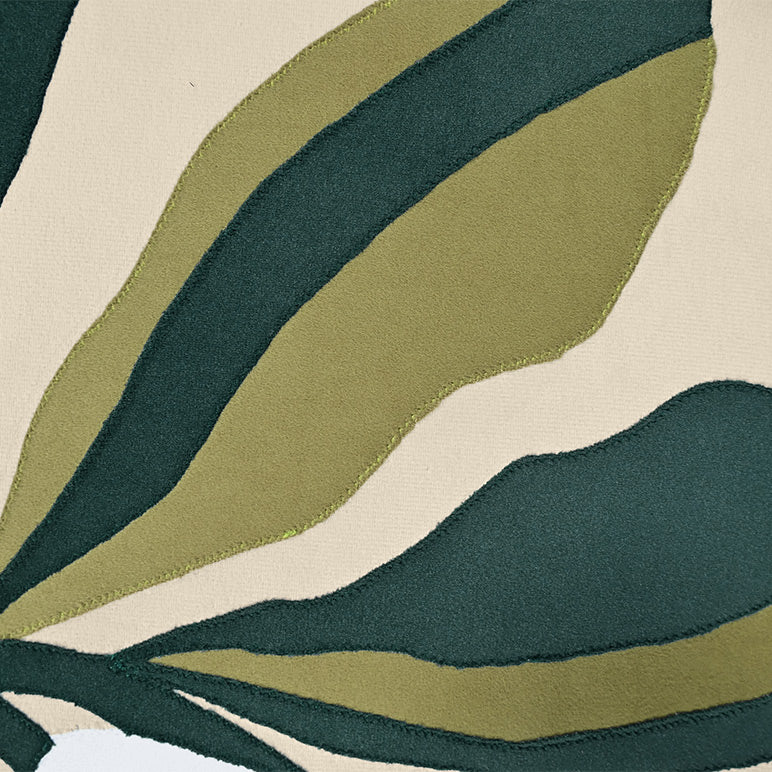 Close-up of a fabric with green and beige leaf pattern