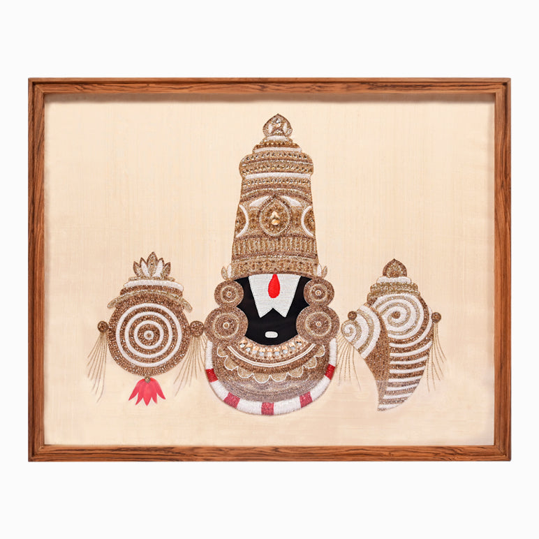 Decorative artwork of a traditional figure with intricate designs in a wooden frame.