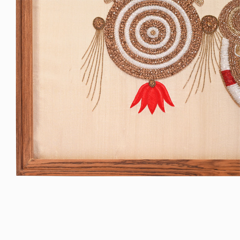 Decorative wall art with circular design and red accent on beige background