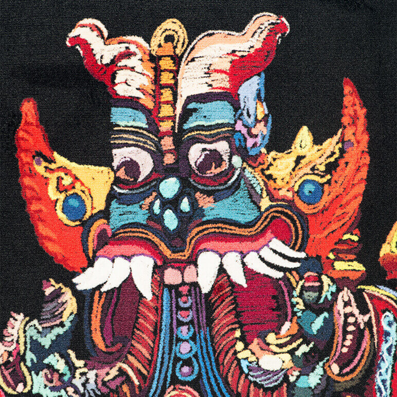 Colorful mask with intricate designs on a black background