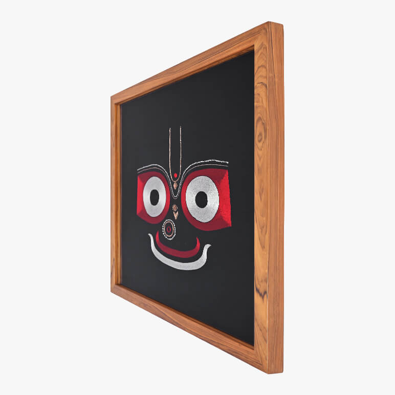 Wooden-framed black board with a red and white face design on a white background