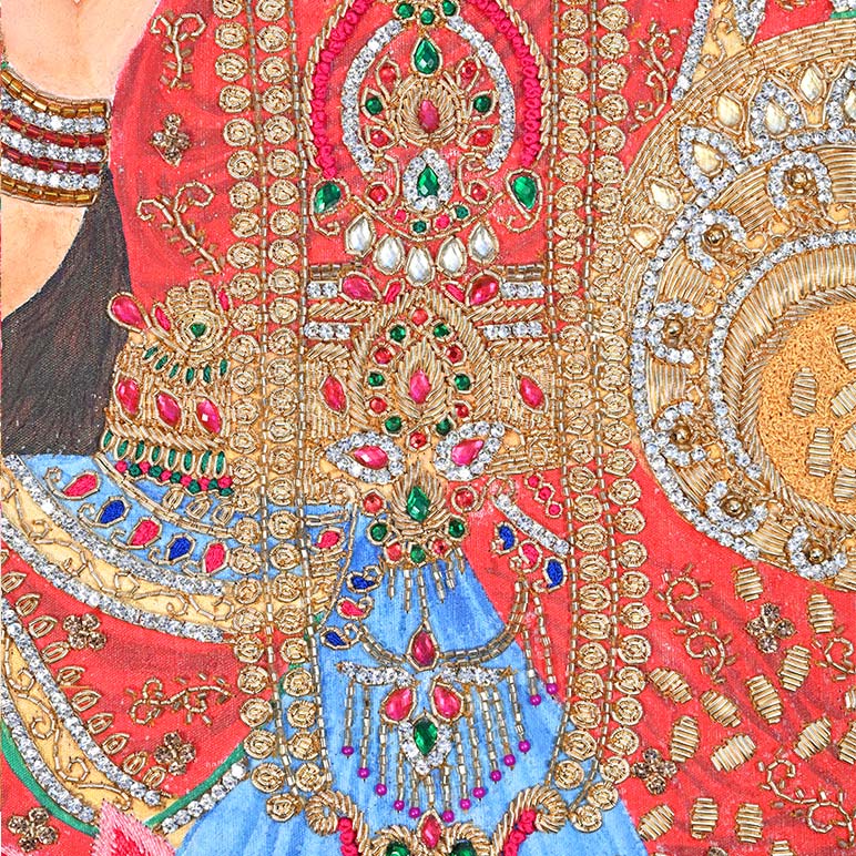 Close-up of a intricately designed garment with gold, red, and blue colors.