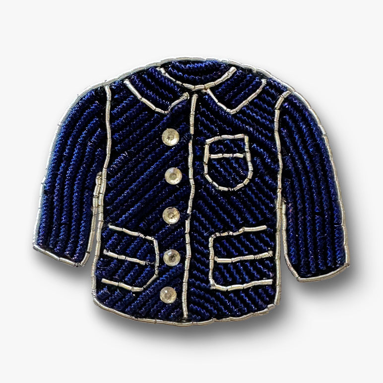 Navy mini jacket brooch pin on a white background