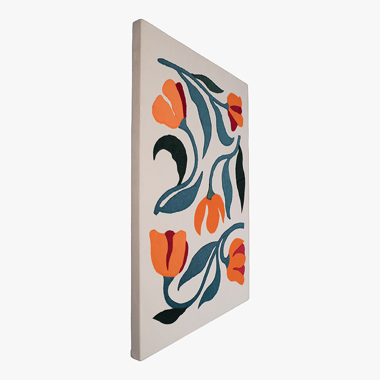 Decorative tile with orange and blue floral design on a white background