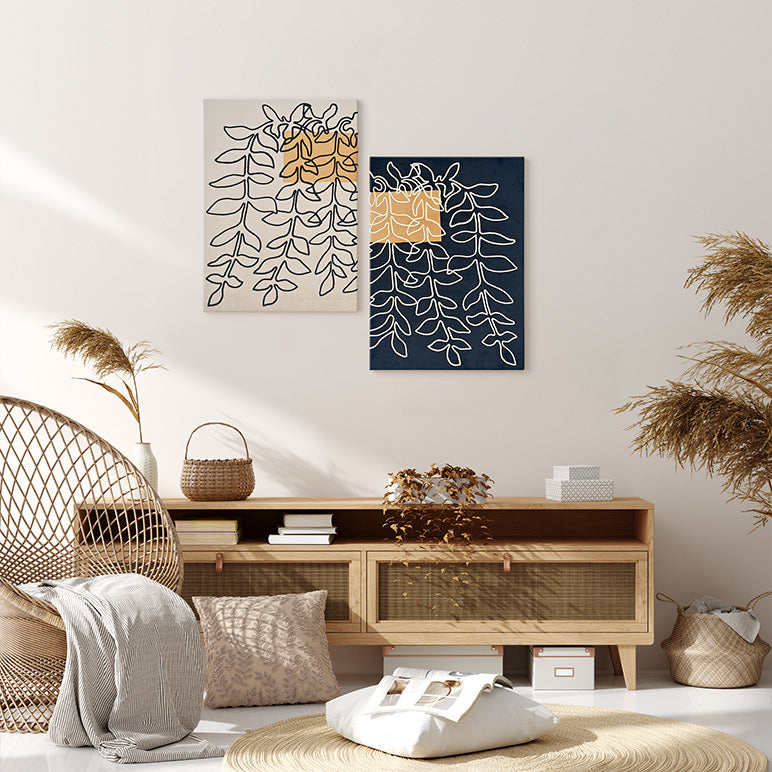 Living room with wooden cabinet, wicker chair, and abstract wall art