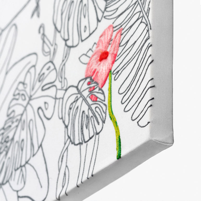 Coloring book with pink flower and black outlines of leaves