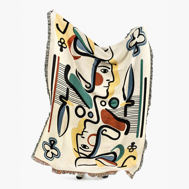 Decorative throw blanket with abstract art design on a white background