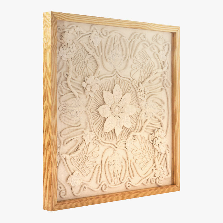 Decorative wall art with floral patterns in a wooden frame on a white background