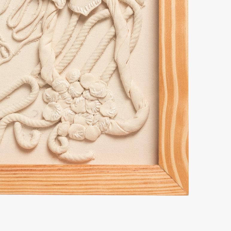 Decorative wall art with intricate designs and a wooden frame.