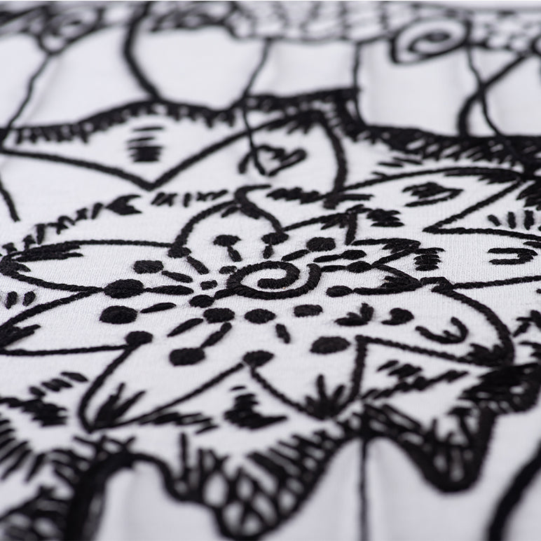 Black and white intricate tattoo design on skin