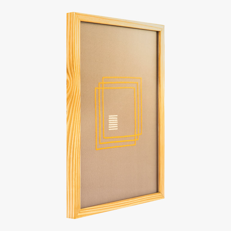 Wooden picture frame with a gold geometric design on a white background