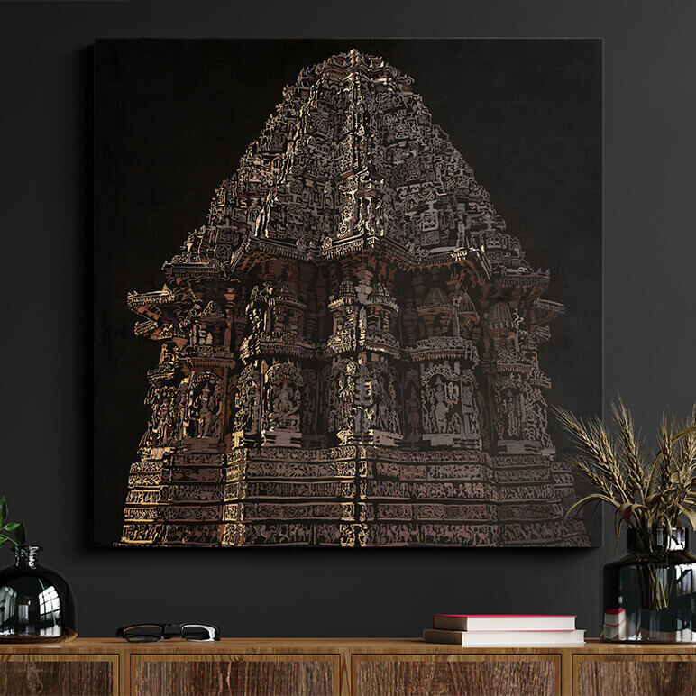 Decorative wall art of a temple on a dark wall above a wooden shelf.