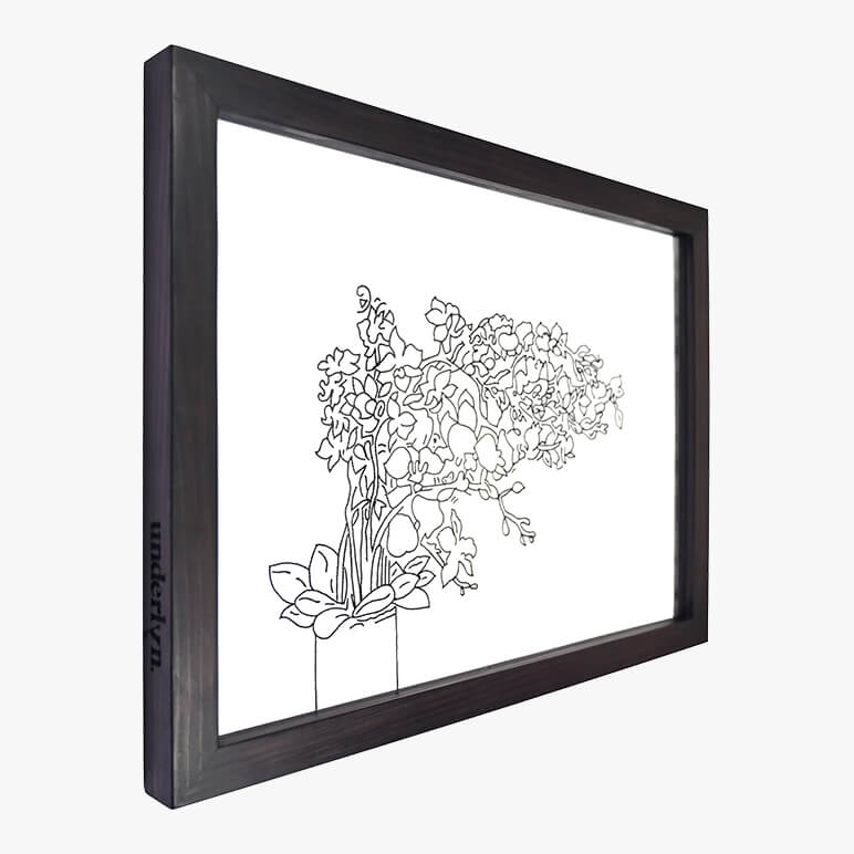 Framed black and white line art of a floral arrangement on a white background