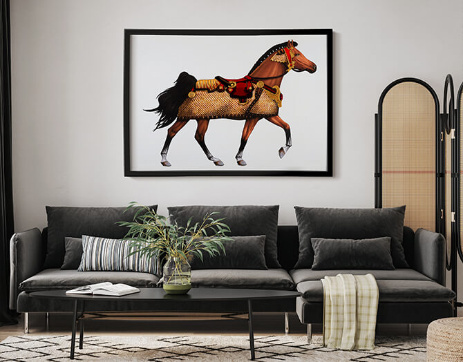Living room with a gray sofa, coffee table, and framed horse artwork on the wall.
