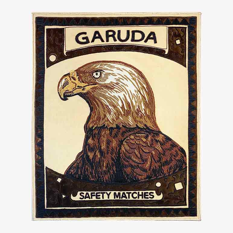 Vintage-style matchbox with an eagle illustration and &