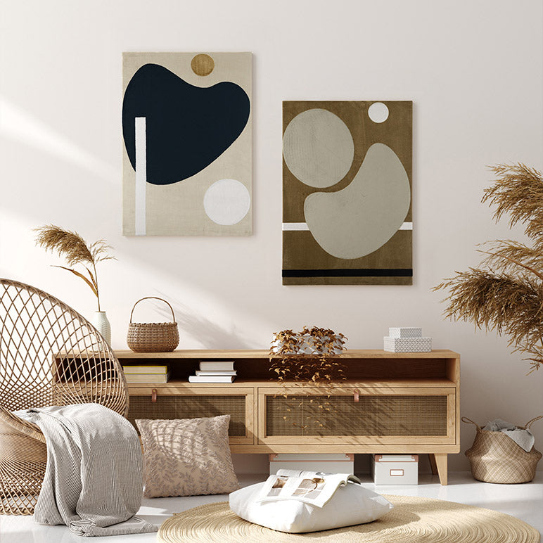 Modern living room with abstract wall art, wooden furniture, and decorative plants.