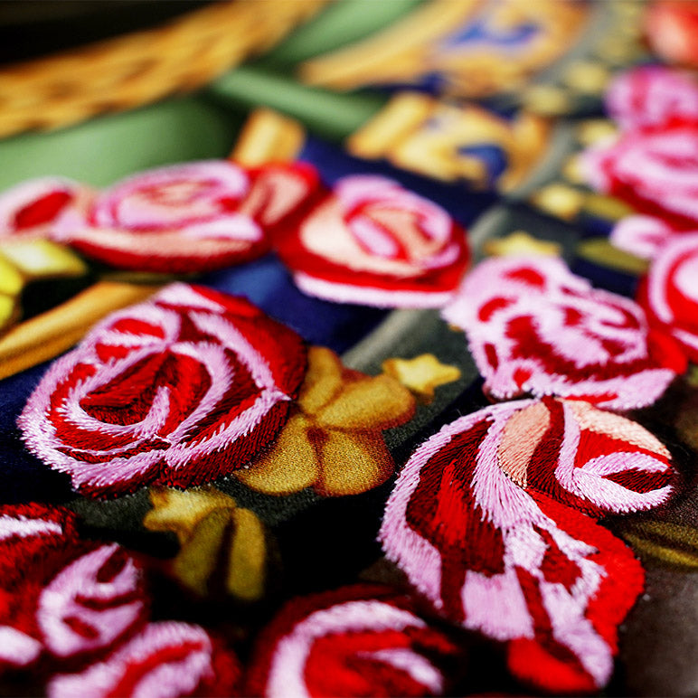 Close-up of embroidered rose patches with a colorful background