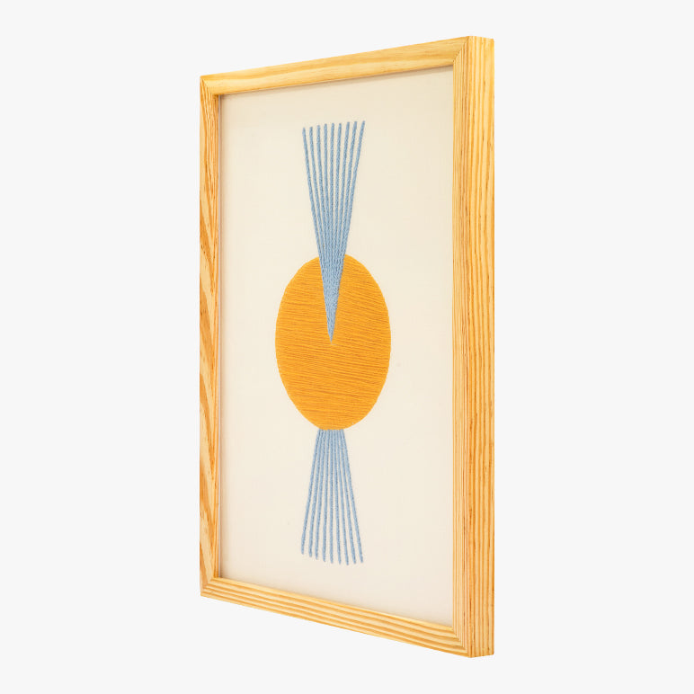 Framed abstract art with orange circle and blue lines on a beige background