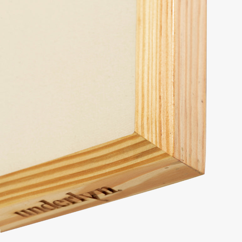 Close-up of a wooden picture frame corner with &