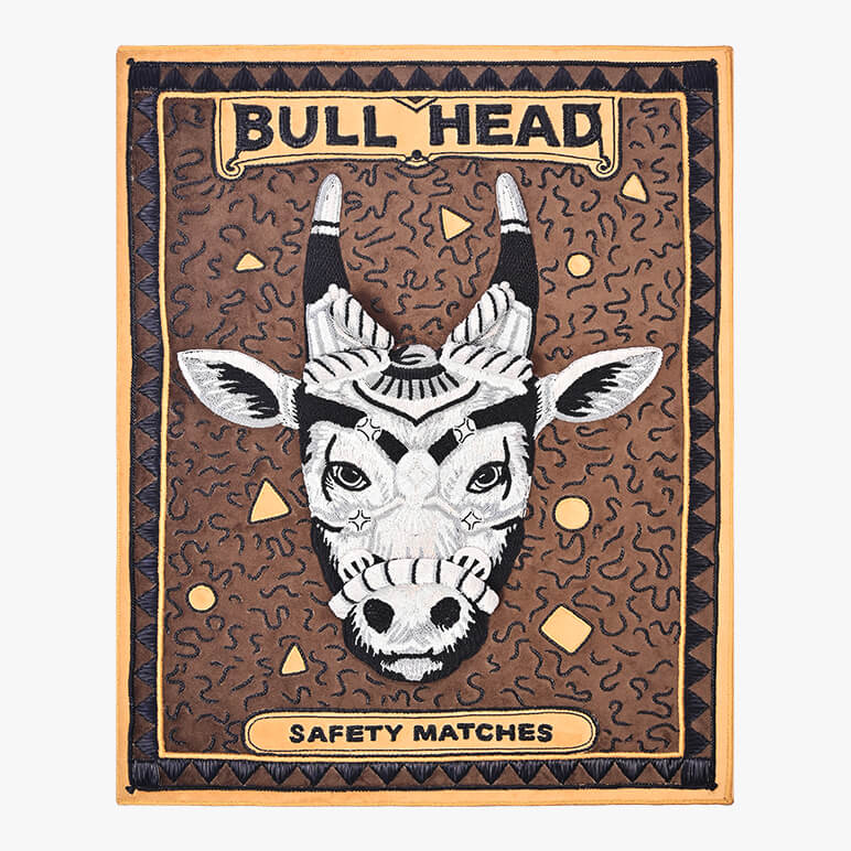 Bull head design on a safety matches packaging with decorative border