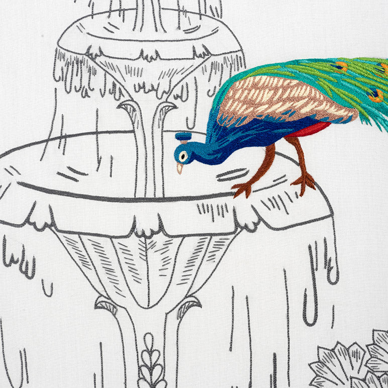 Colorful peacock on a black and white floral design