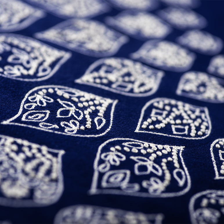 Close-up of blue fabric with white geometric patterns