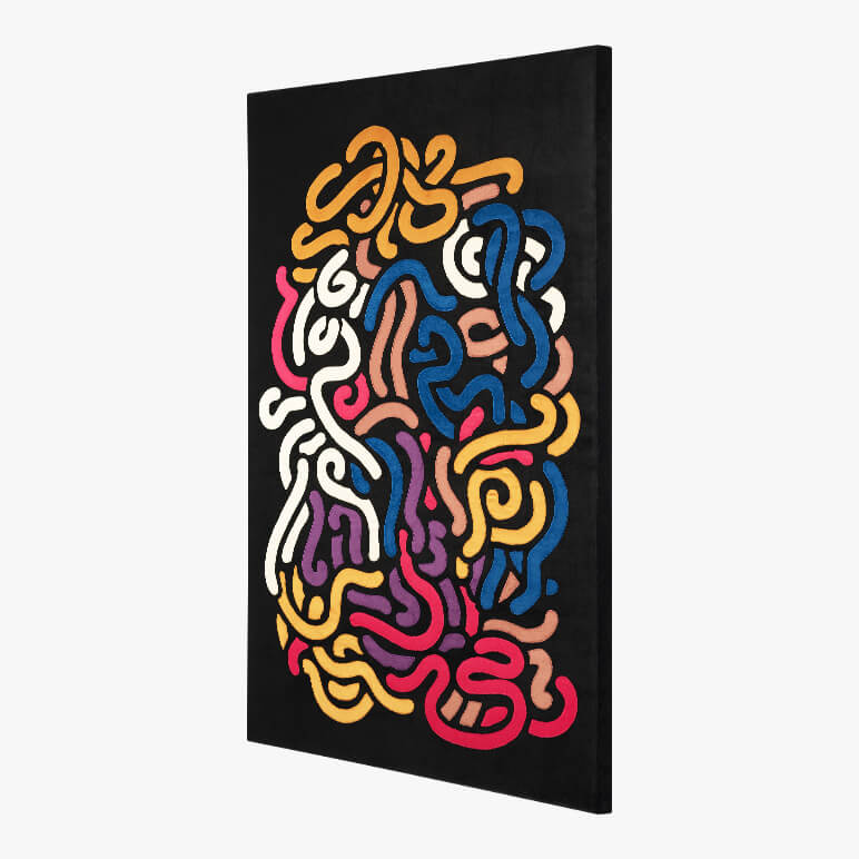 Colorful abstract textile wall art done in patchwork on a black background