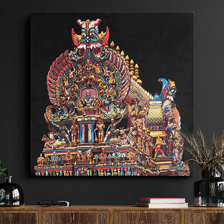 Colorful temple artwork on a dark wall with a wooden shelf below.