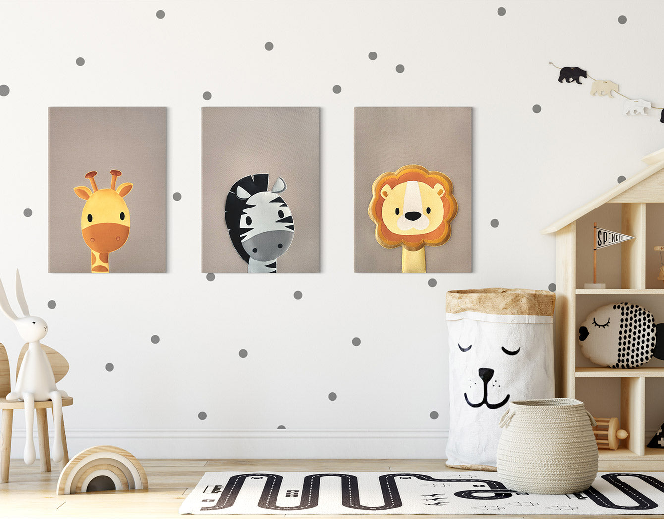 Children's room with wall art of a giraffe, zebra, and lion.