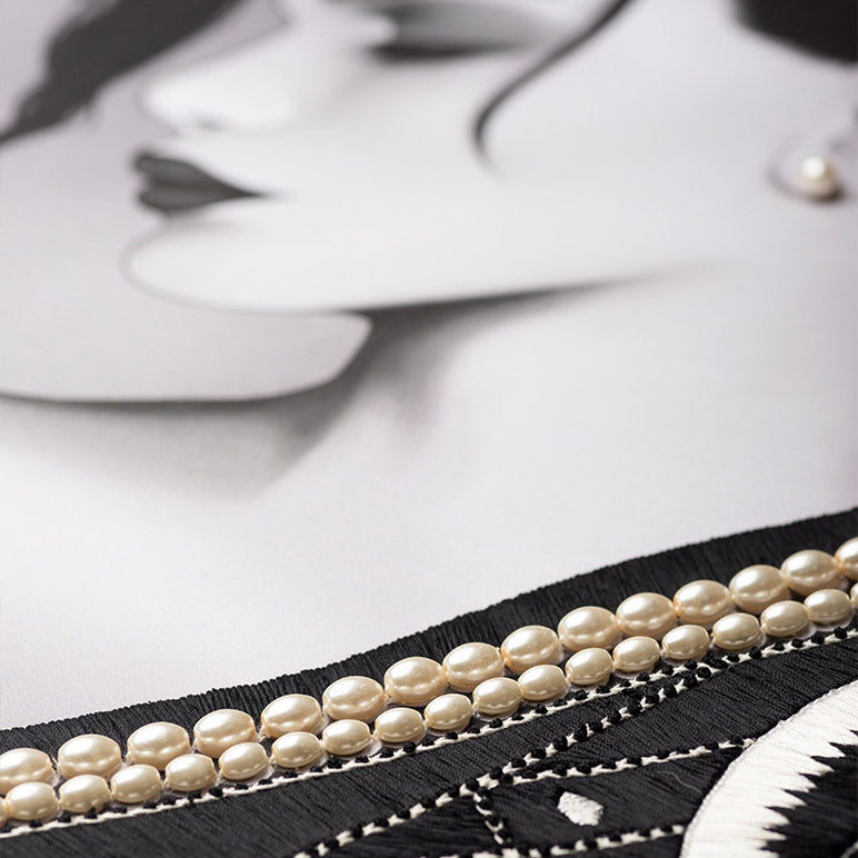 Pearl belt on a mannequin with a blurred background