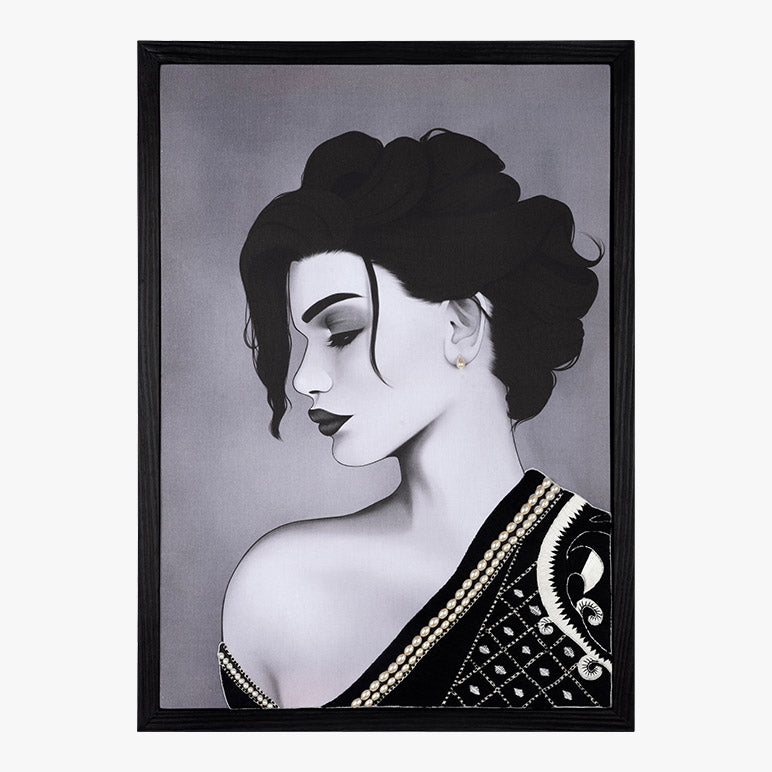 Framed artwork of a woman in a saree with a black frame on a gray background