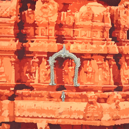 Decorative metal arch on a textured orange surface