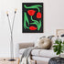Living room with a white sofa, decorative pillows, and a modern abstract painting of red tulips on a black background.