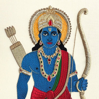 Close-up of gold zardozi embroidery and silk thread painting details on Lord Rama artwork
