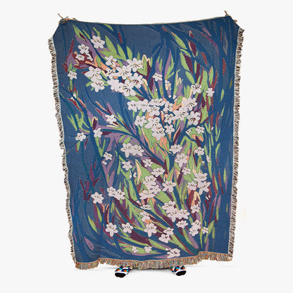 Floral patterned throw blanket on a white background