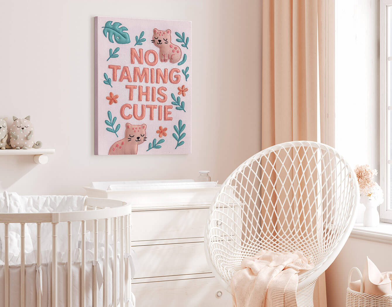 Nursery room with a crib, chair, and decorative pink nursery wall art.