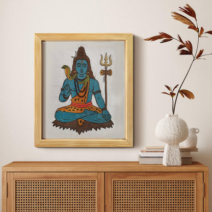 Framed artwork of Hindu deity Shiva on a wall above a wooden cabinet with decorative items.