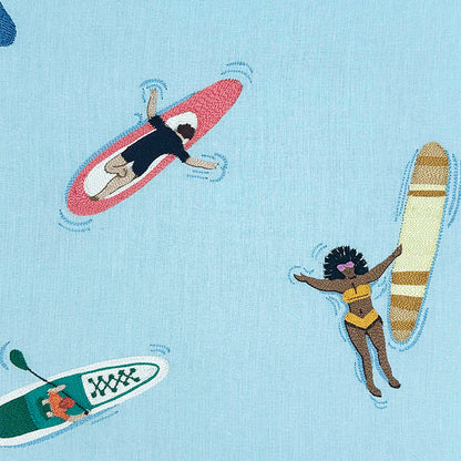 Embroidered pattern of people with water activities on a light blue background