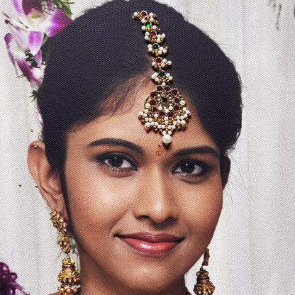 Woman wearing traditional jewelry with a blurred background
