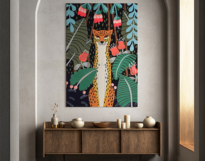 Colorful artwork of a cheetah in a jungle setting on a wall above a wooden console table.