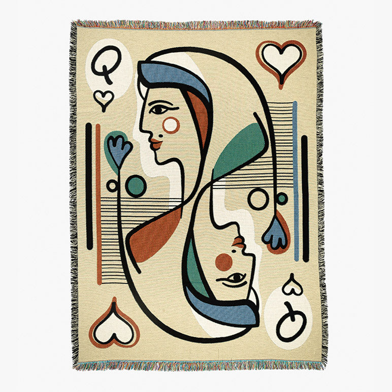 Designer throw blanket with abstract design of a queen playing card seen on a white background