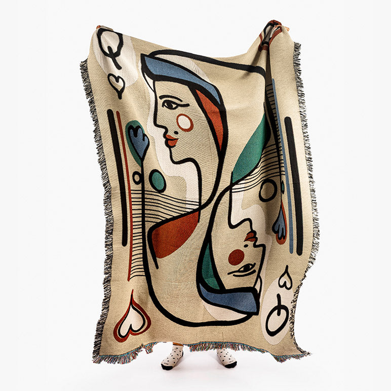 Decorative throw blanket with abstract art design held up