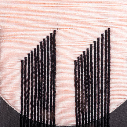 Textured fabric with black and white pattern on a beige background