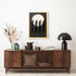 Wooden sideboard with decorative items against a white wall