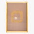 Framed artwork with geometric design on a plain background