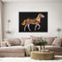 Decorative horse painting on a wall above a sofa in a living room.