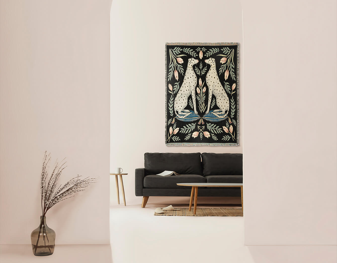 Woven cotton throw blanket with two Dalmatians framed as a wall tapestry in a pastel hued room